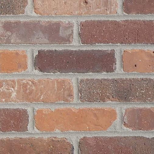 A close - up of a brick wall

Description automatically generated