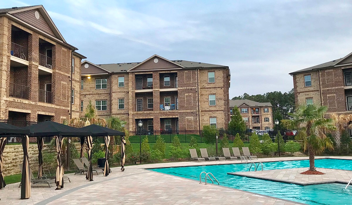 Garden apartment community with matching mortar on every brick building around the pool.